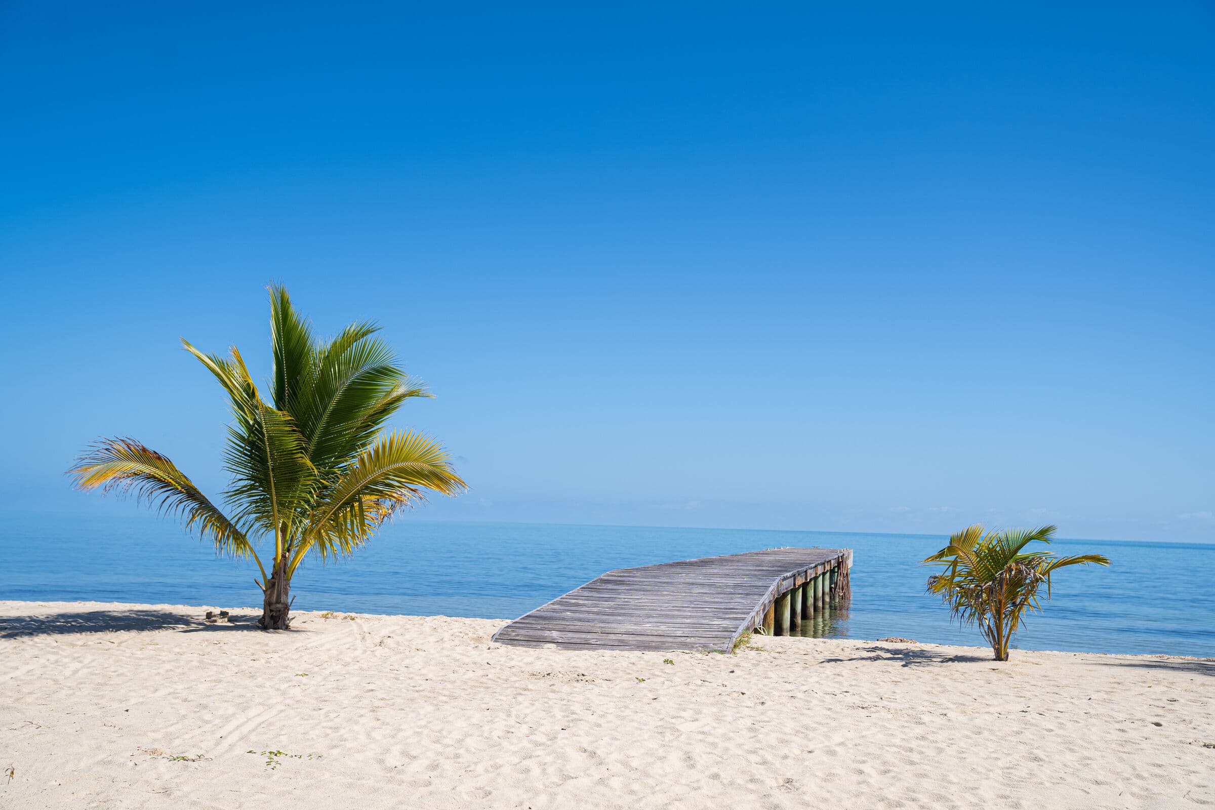 Community members on a beach jetty