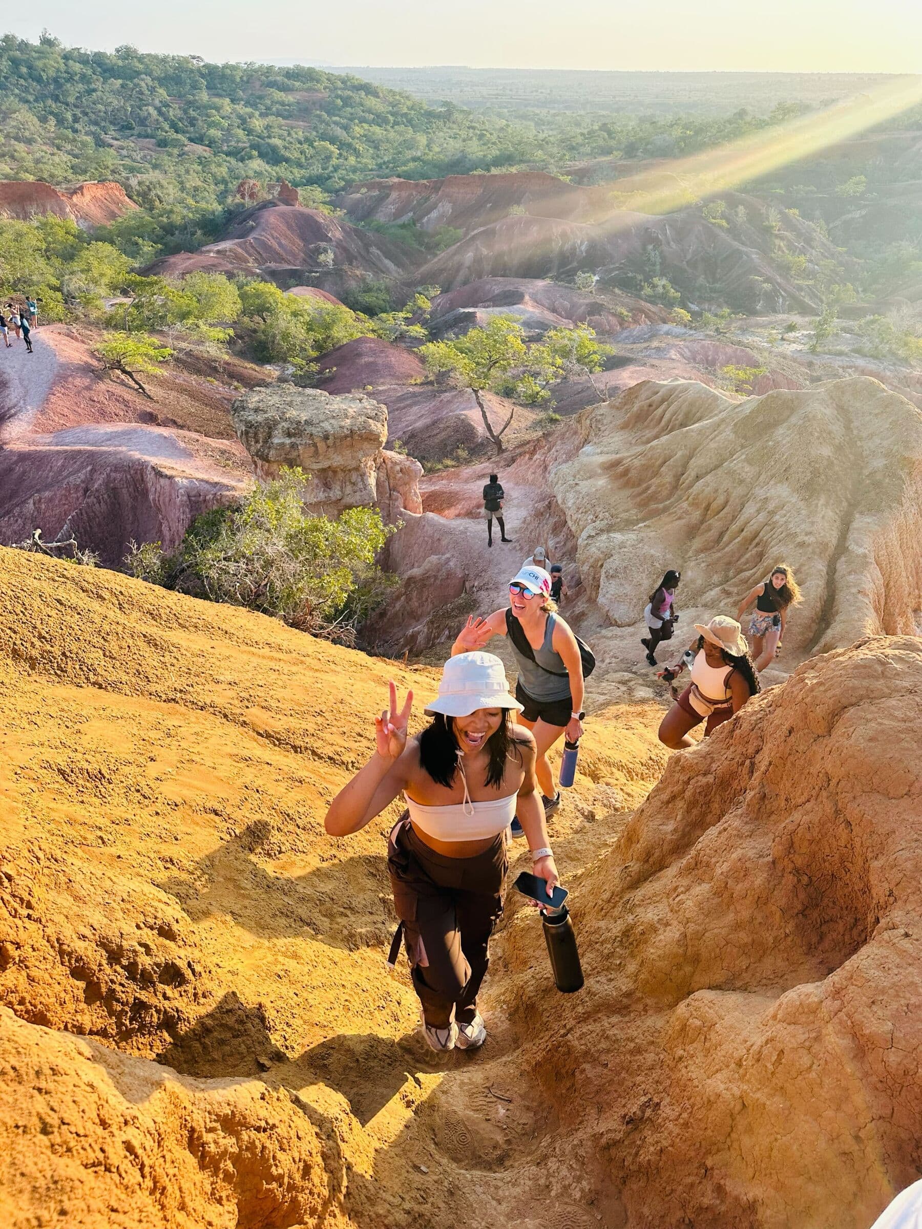 Group hiking through a dramatic canyon landscape
