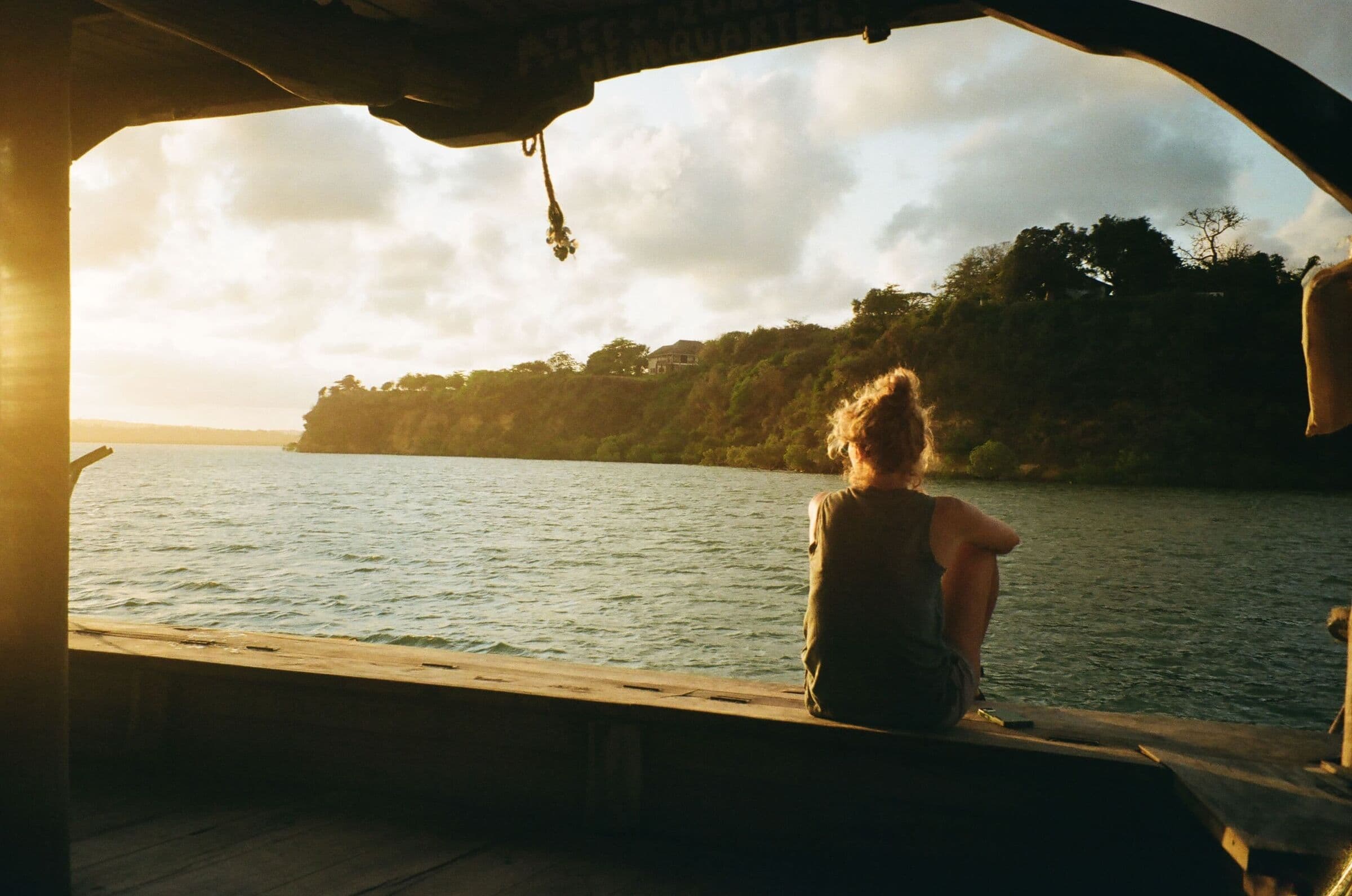 Community member watching the sunset from a boat