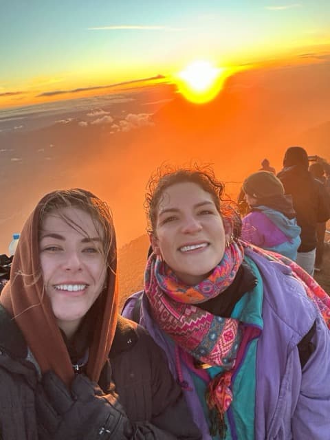 Community members taking a selfie at a volcano