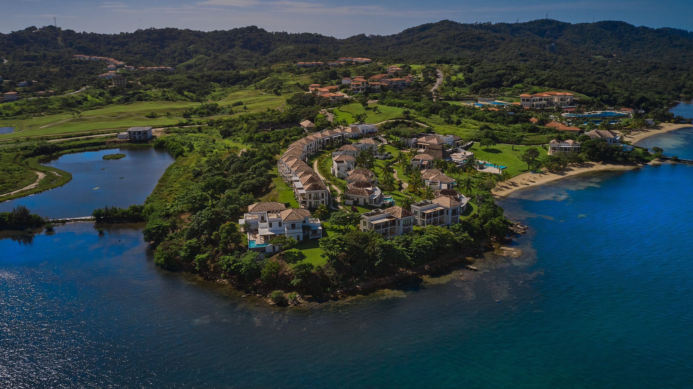 Aerial view of the safe, walkable oceanfront village at Próspera, Roatán